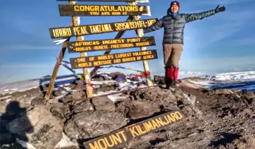 Bret McGowen at the summit of Mount Kilimanjaro in Tanzania